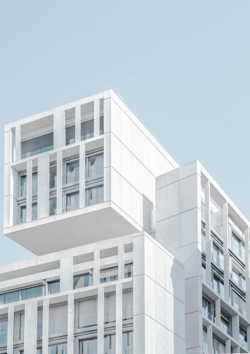 House of Quiet Stone — stacked white volumes with deep cantilevers
