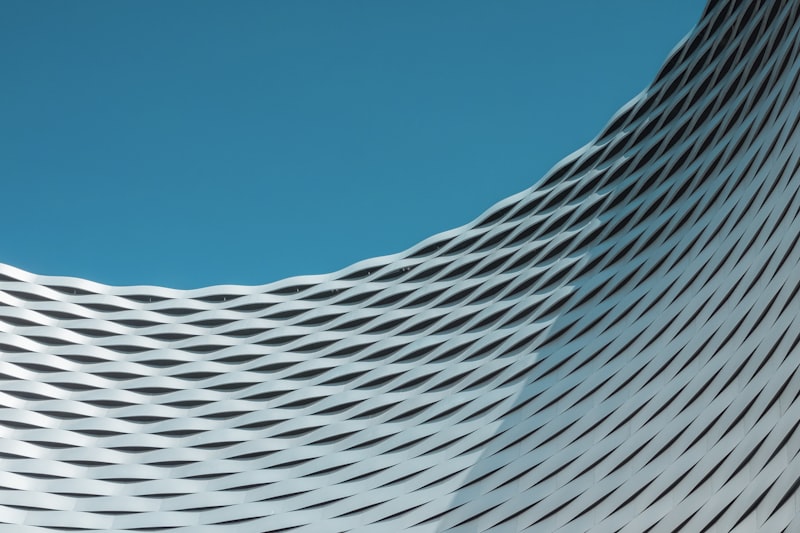 Estuary Pavilion — woven lattice canopy against open sky